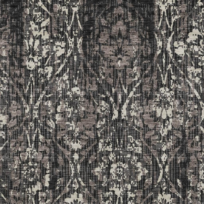 Close-up of charcoal and black damask area rug with cream ivory abstract pattern