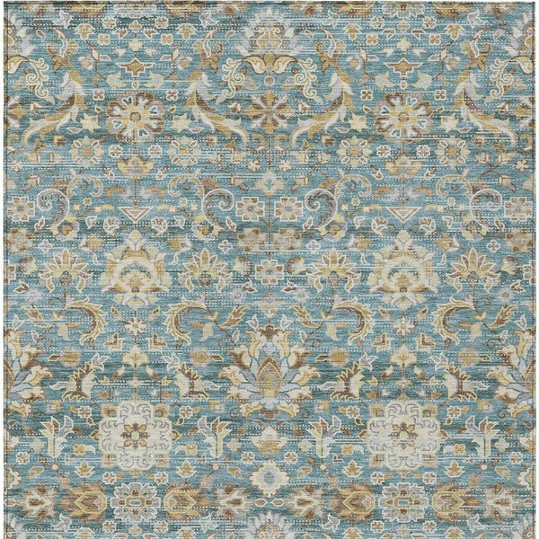 Teal blue rug with beige and tan floral medallion pattern, distressed look