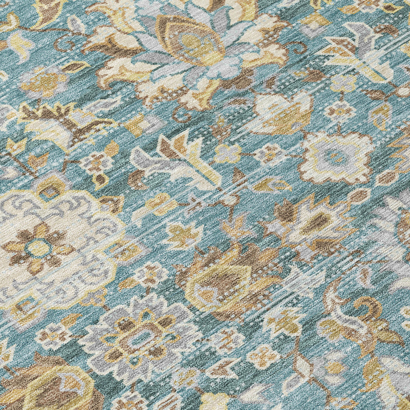 Teal blue rug close-up with beige floral motifs and scrolling medallion design