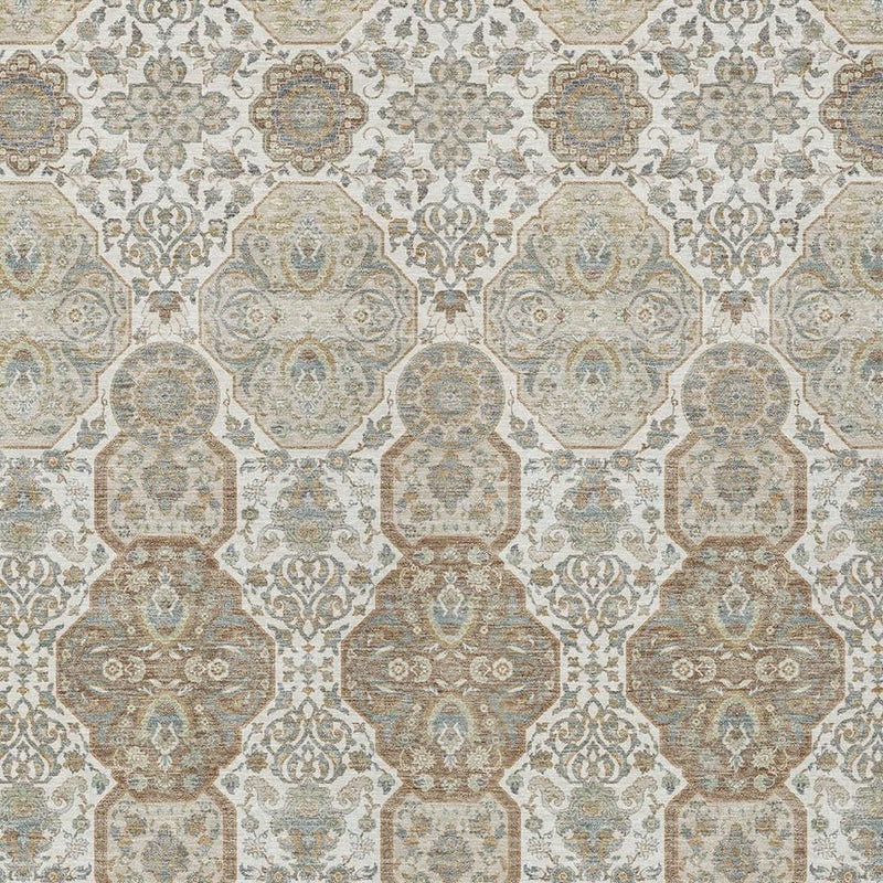 Close-up of ivory area rug showing repeating medallion floral motifs in blue and taupe