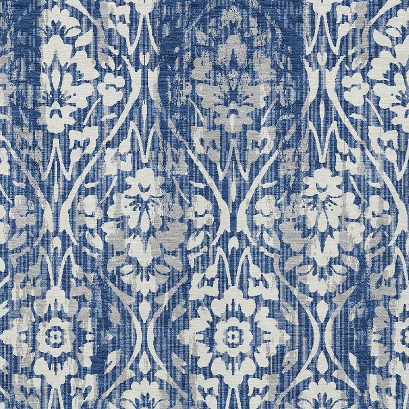 Blue damask area rug close-up of repeating floral motif