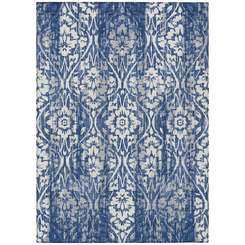 Rectangular blue damask area rug with distressed pattern