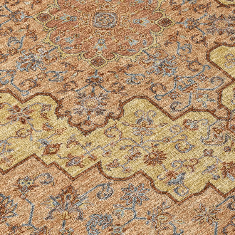 Washable indoor outdoor area rug with copper and gold medallion pattern, blue accents.