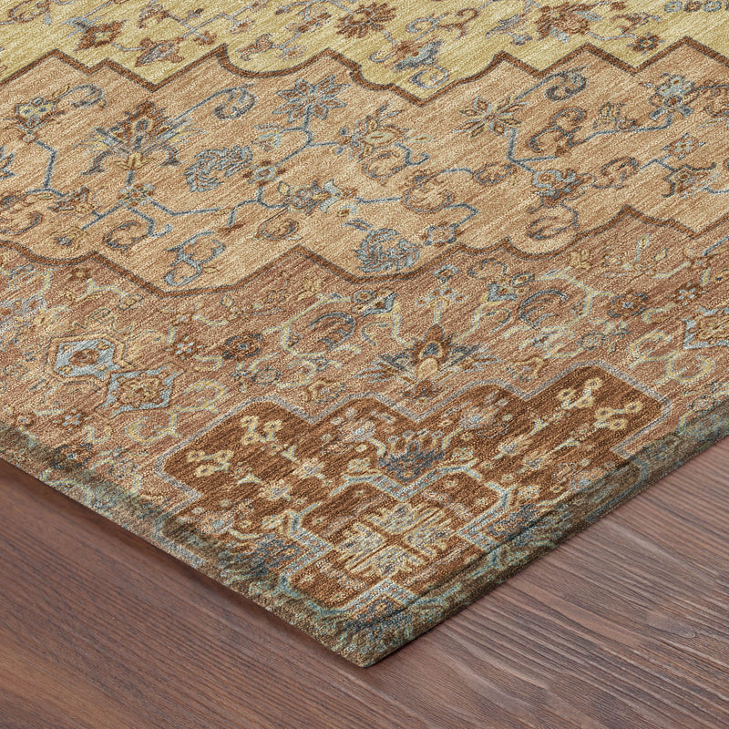 Copper and gold patterned area rug corner with blue motifs on textured pile.