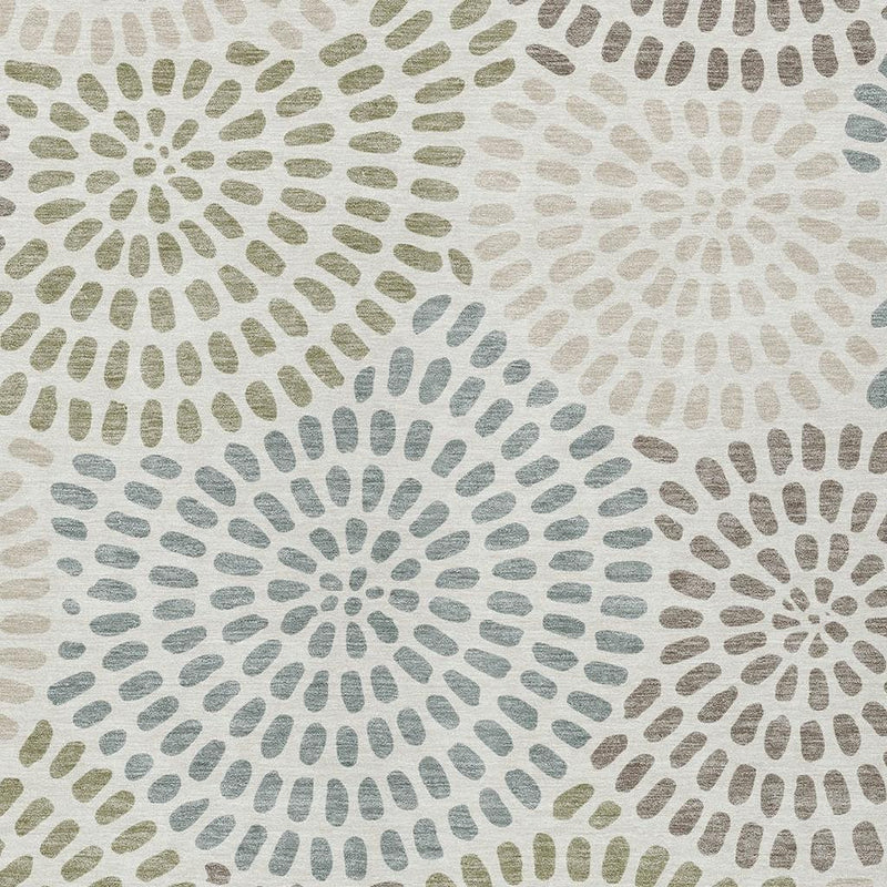 Geometric burst pattern area rug in ivory with sage and dusty blue tones