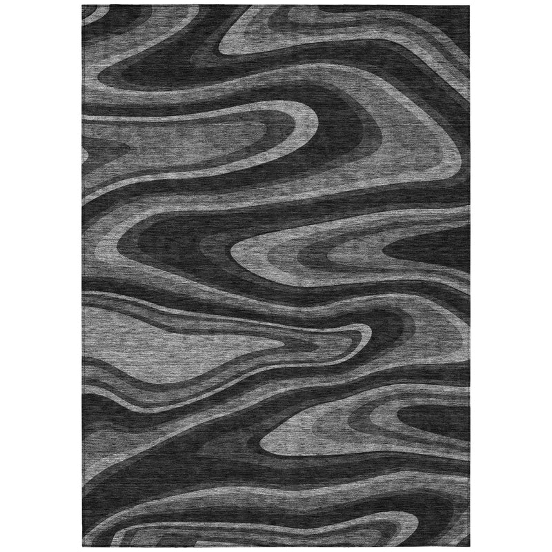 Rectangular abstract area rug with black and gray swirled lines and wavy stripe texture.