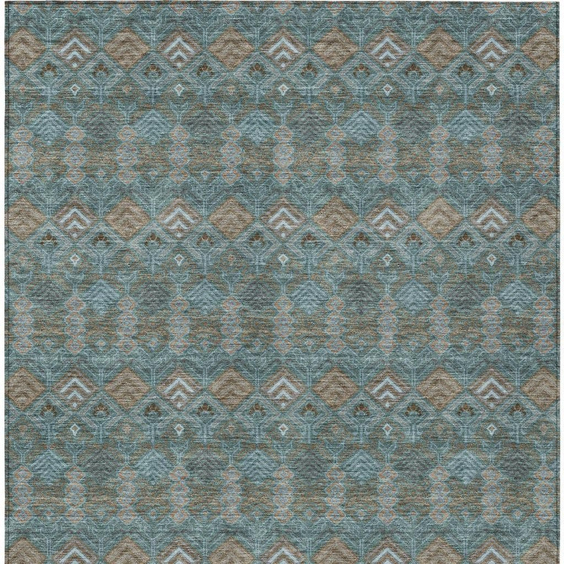 Teal blue and tan geometric area rug with diamond motif and border detail