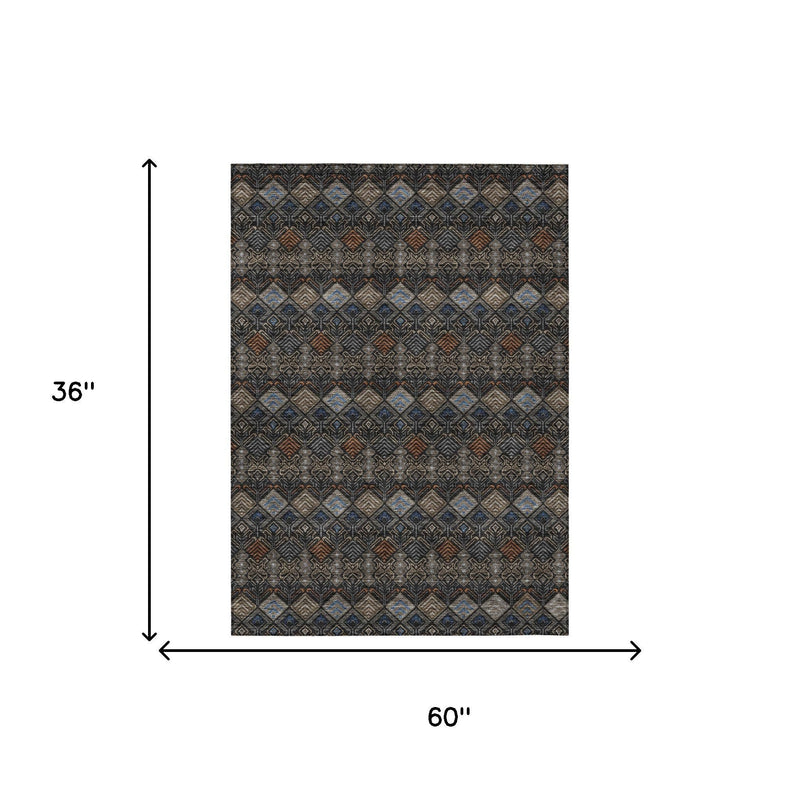 Rectangular geometric area rug, 60 in x 36 in, dark charcoal with blue and tan