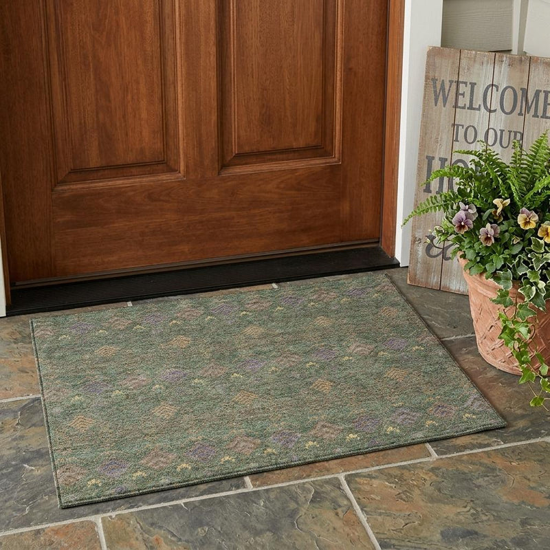 Green and olive area rug with multicolor geometric pattern for indoor or outdoor use