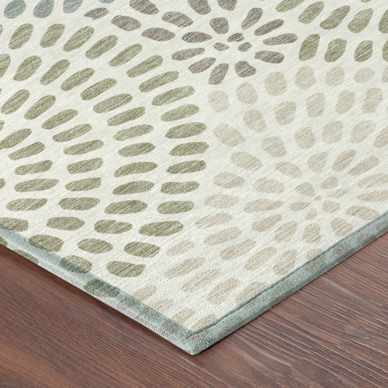 Ivory and sage geometric area rug corner with subtle blue-green border edge