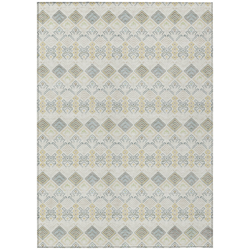 Area rug with ivory background and repeating geometric motifs in blue, green, and gold