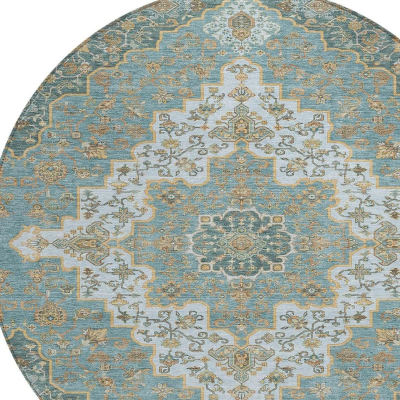 Round area rug featuring teal ground with large cream medallion and gold-toned tracery