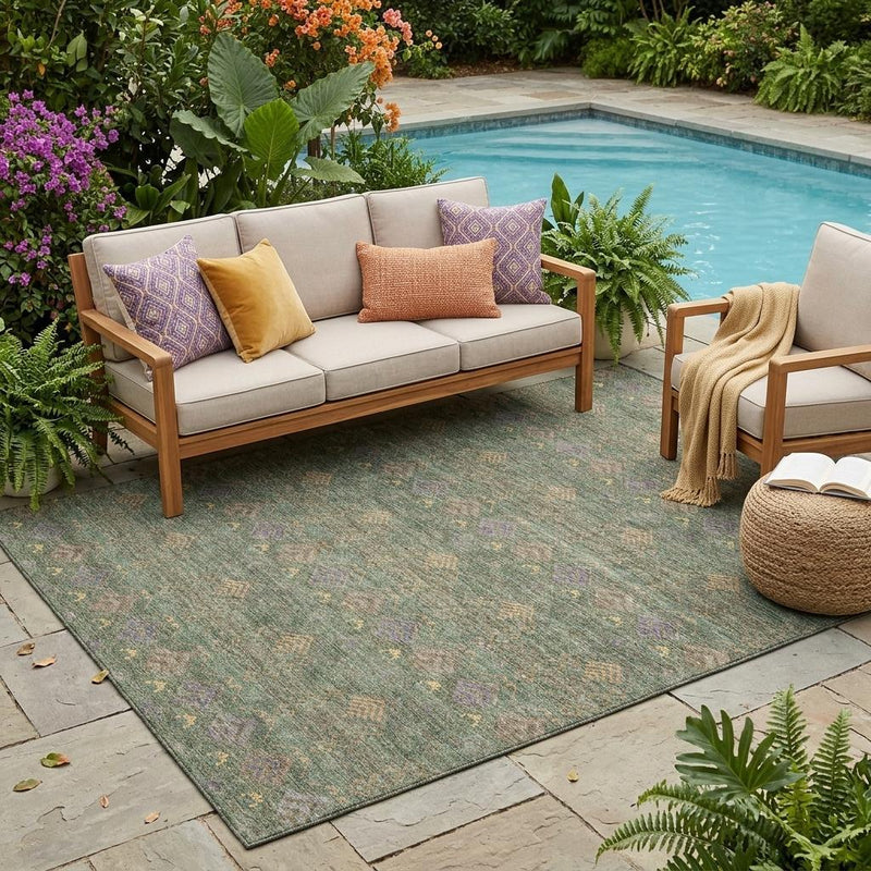 Outdoor rectangular area rug in green and olive with repeating geometric diamond pattern
