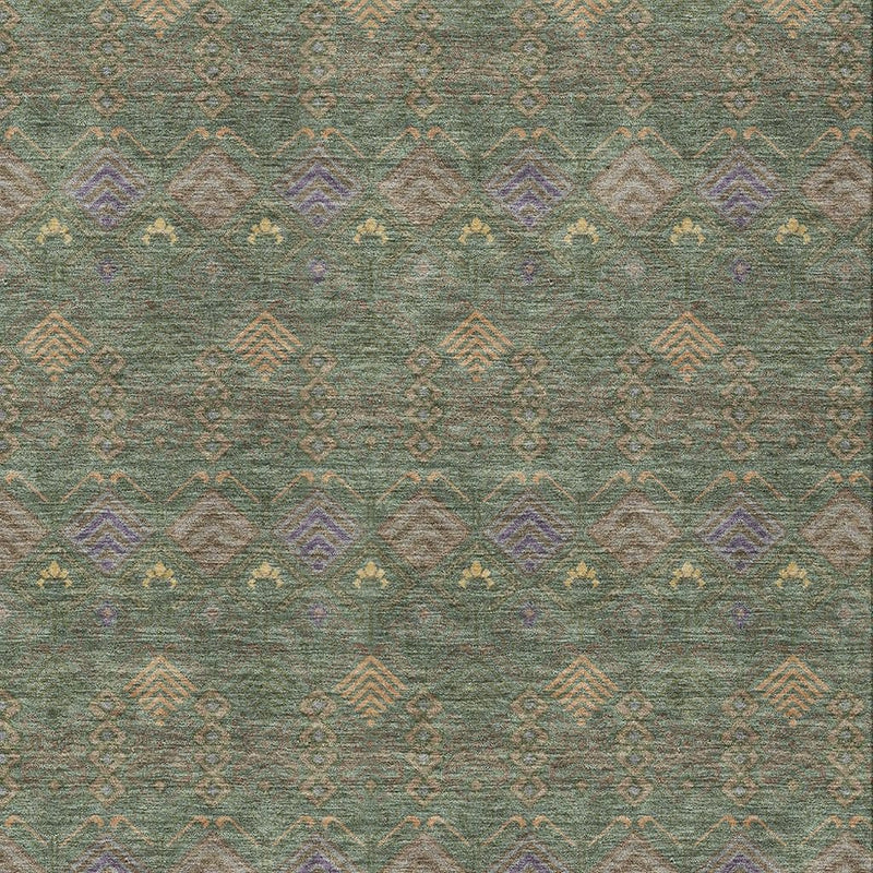 Close-up of green and olive geometric area rug pattern with small diamond accents