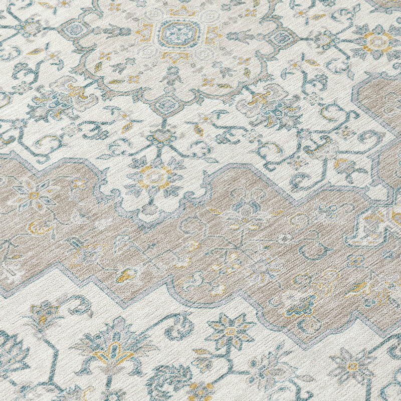 Rug texture and pattern detail with light blue, ivory, and gold-toned accents