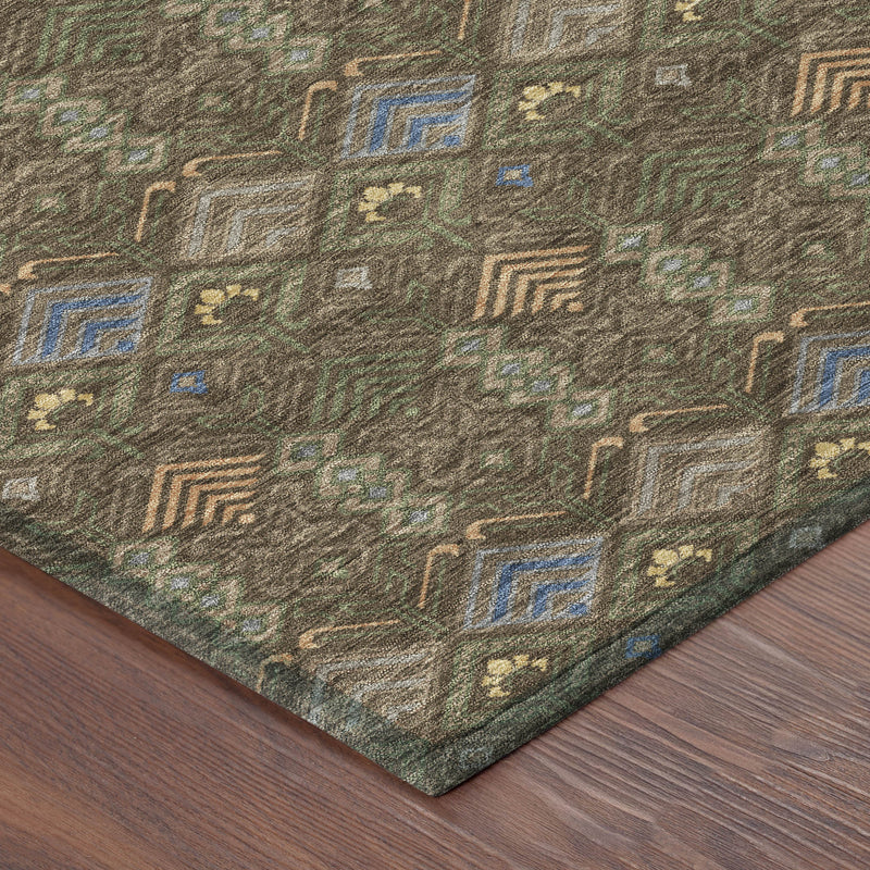 Corner of geometric area rug in dark brown with blue and orange accents