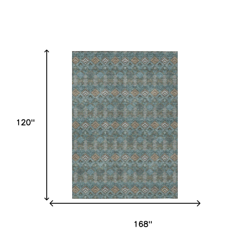 Teal geometric area rug with repeating diamond pattern, tan and dark accents