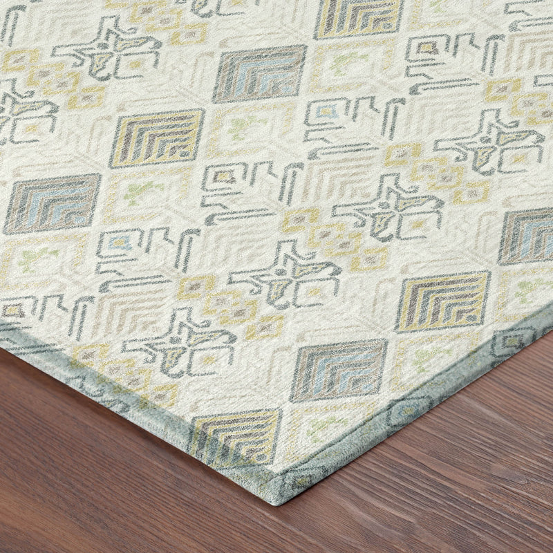 Ivory geometric area rug corner with blue-gray and wheat square and diamond pattern