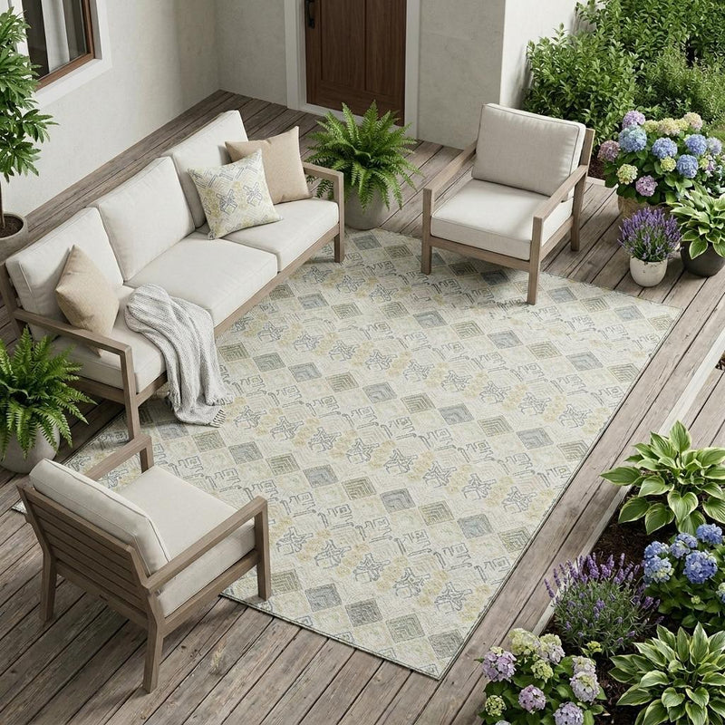 Geometric area rug in ivory with repeating blue-gray and wheat motifs on flat weave