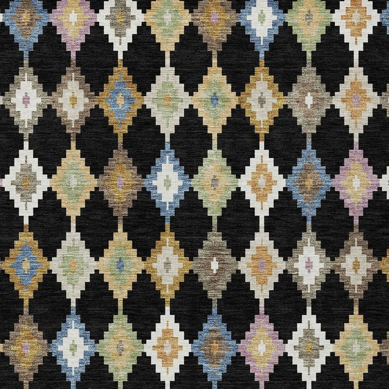 Close-up of black, beige, and multicolor Aztec diamond pattern area rug.