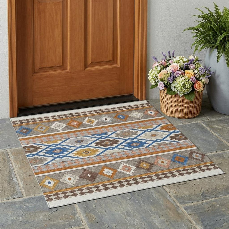 Southwestern area rug on stone tile floor with multicolor geometric design