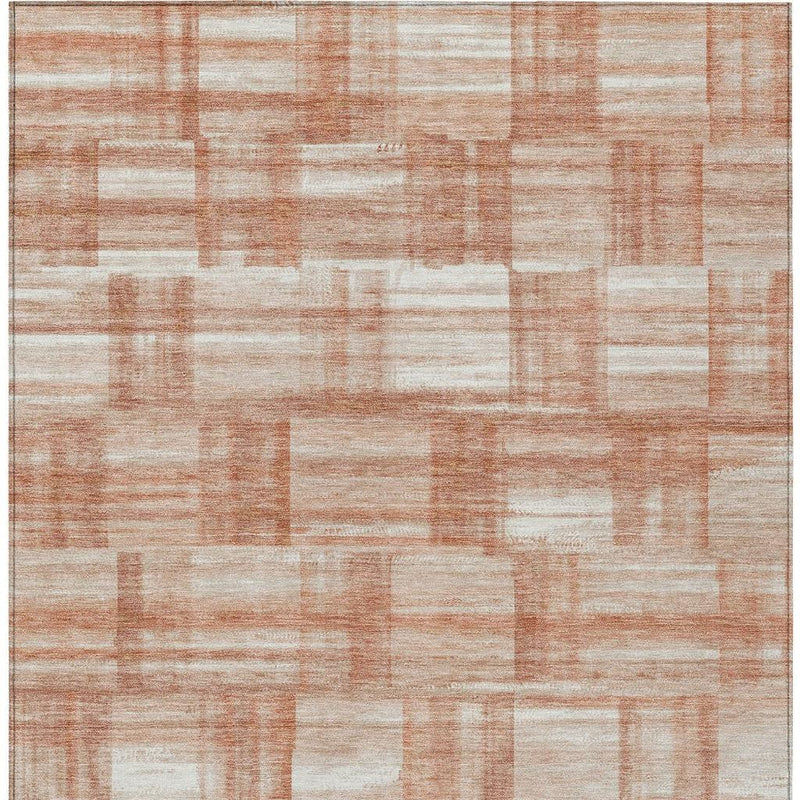 Rectangle area rug with cream and copper-orange patchwork pattern and border