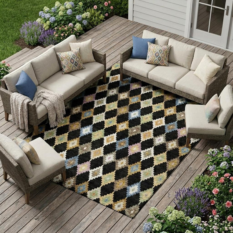 Outdoor patio seating set over black, beige, and multicolor diamond Aztec area rug