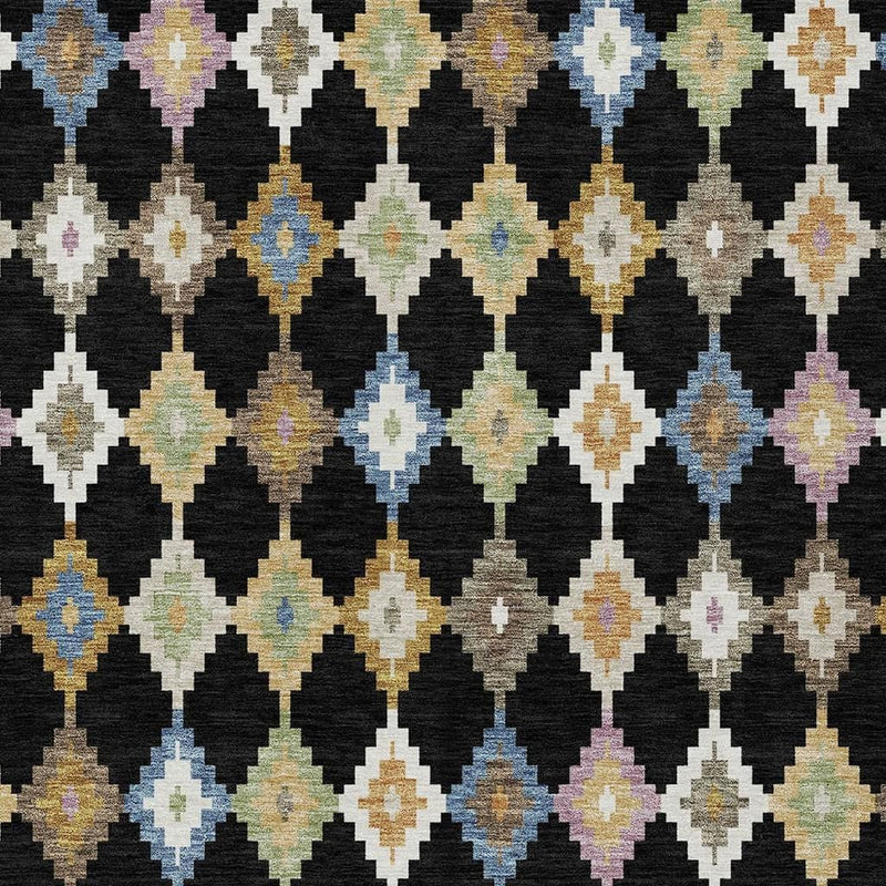 Close-up of black area rug with multicolor diamond and arrow Aztec pattern