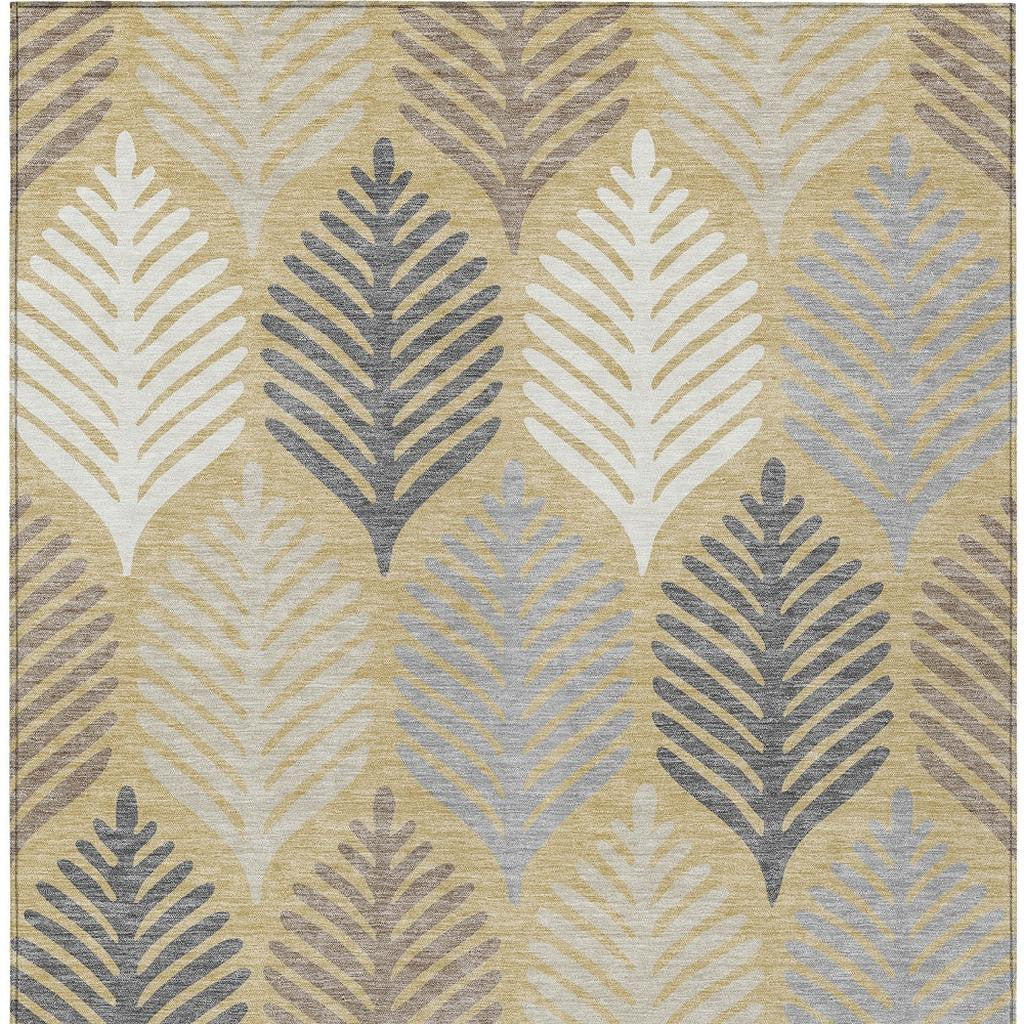 Top view of ivory rug featuring a gold and blue-gray feather leaf pattern