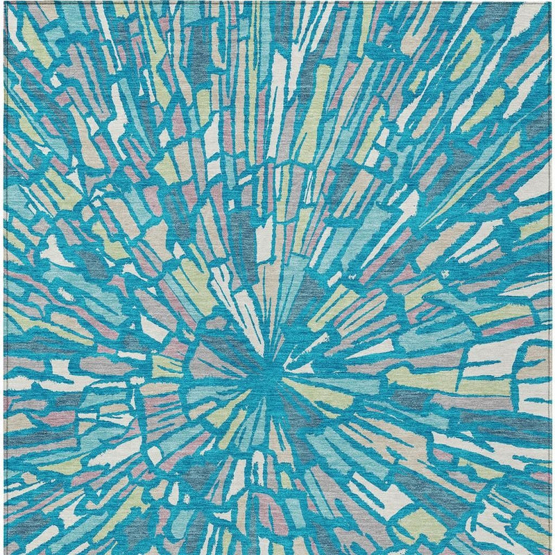 Teal blue abstract area rug with central sunburst burst pattern