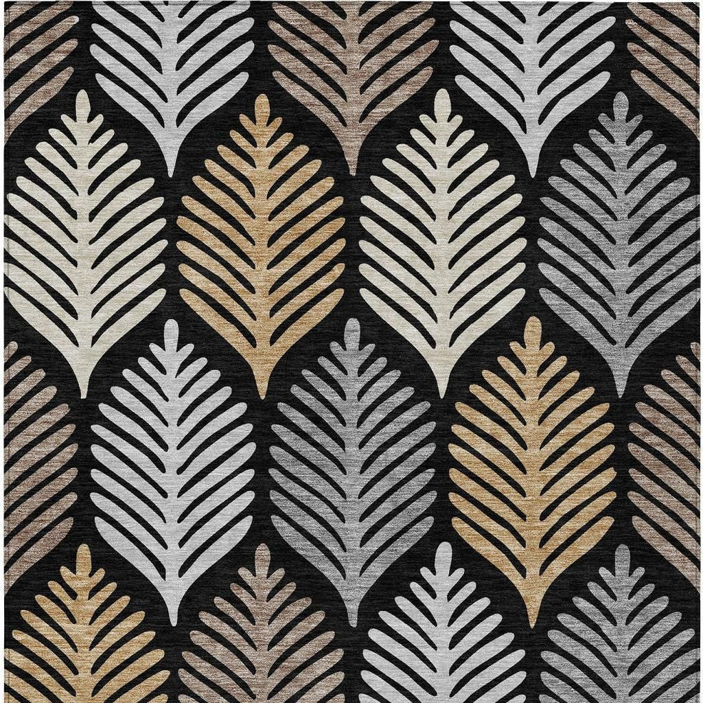 Rectangular black, gray, and beige leaf-pattern area rug with gold highlights.