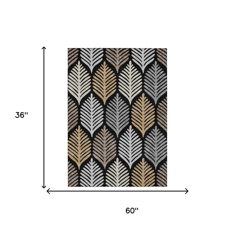 60 x 36 in black and gray leaf-pattern area rug with beige and gold accents.