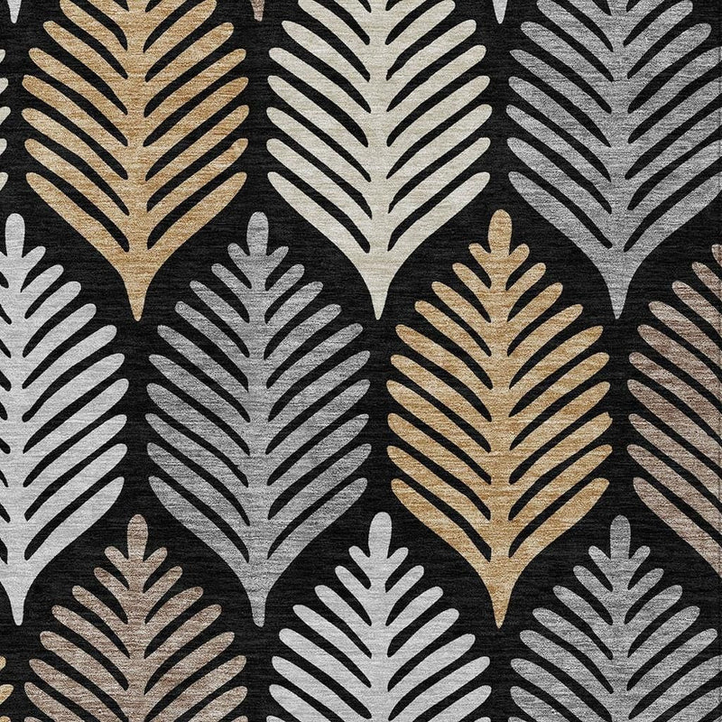 Close-up of black and gray leaf-pattern area rug with beige and gold highlights.