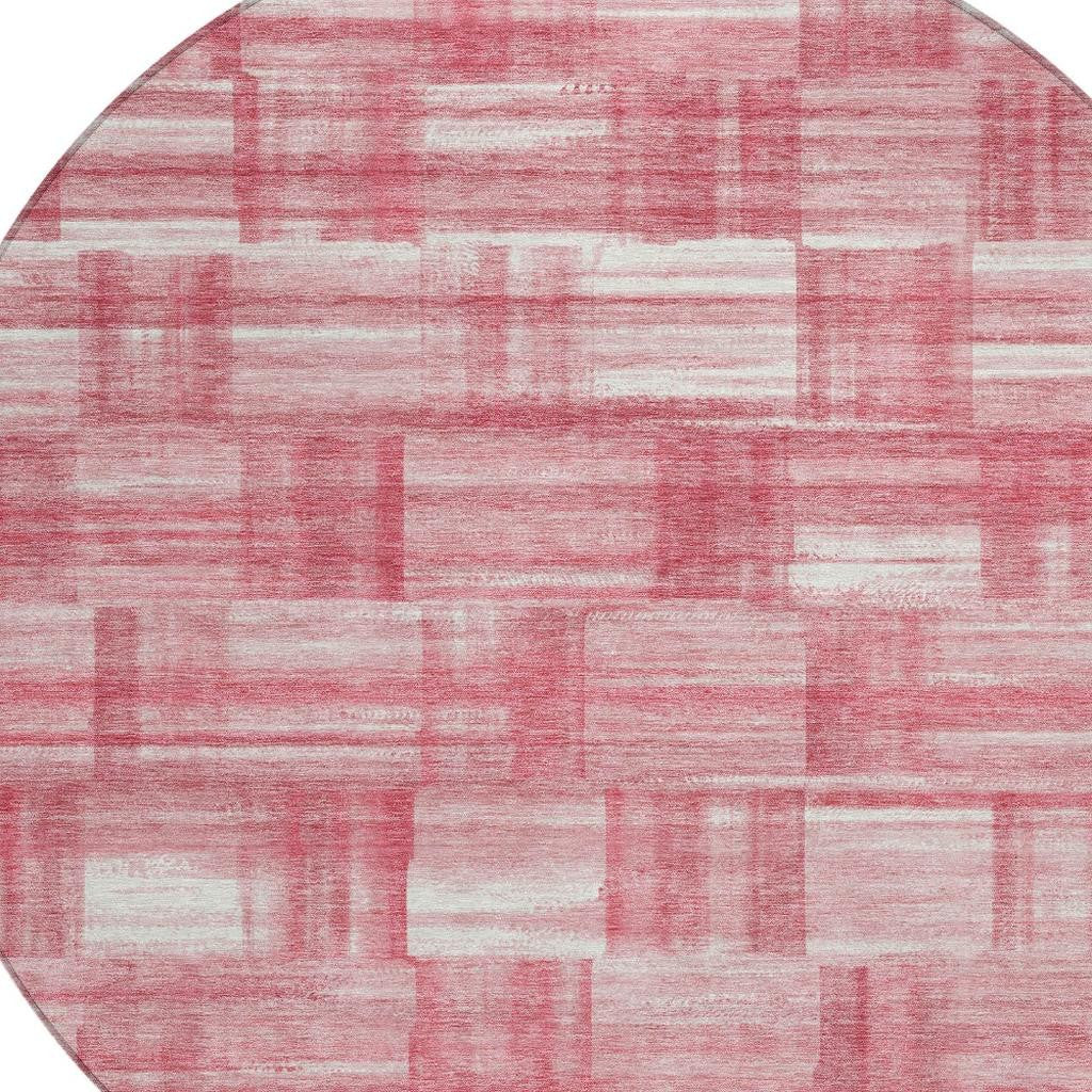 Close-up of pink and ivory patchwork rug pattern with distressed stripe texture