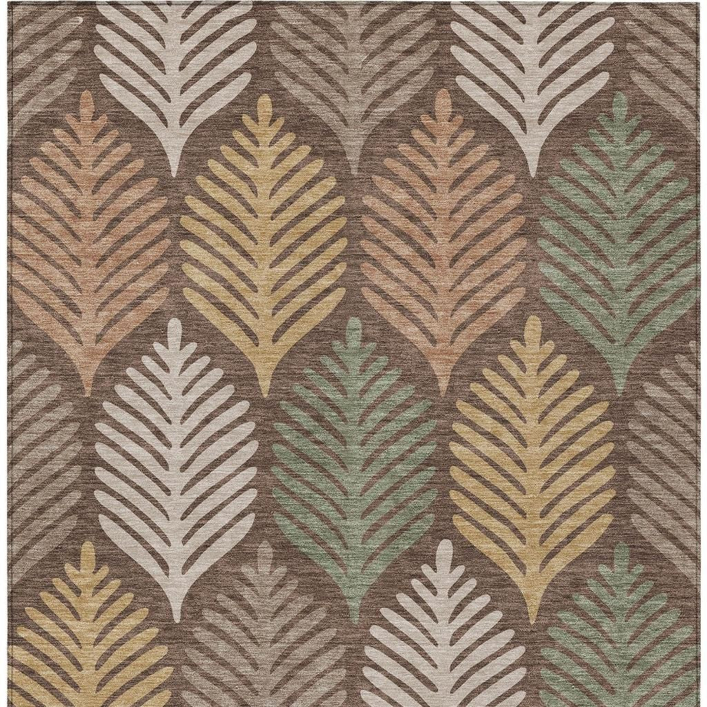 Chocolate-brown area rug with beige, tan, and green leaf-pattern motif