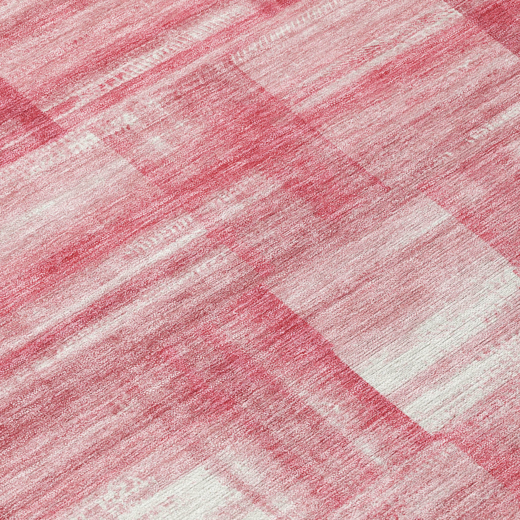 Pink and ivory area rug with distressed stripe and block pattern, tight weave