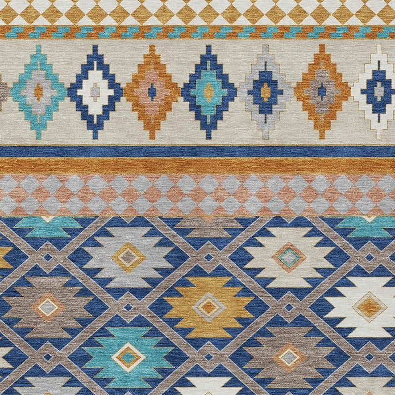 Geometric border area rug in navy and ivory with teal and tan diamond and cross patterns.