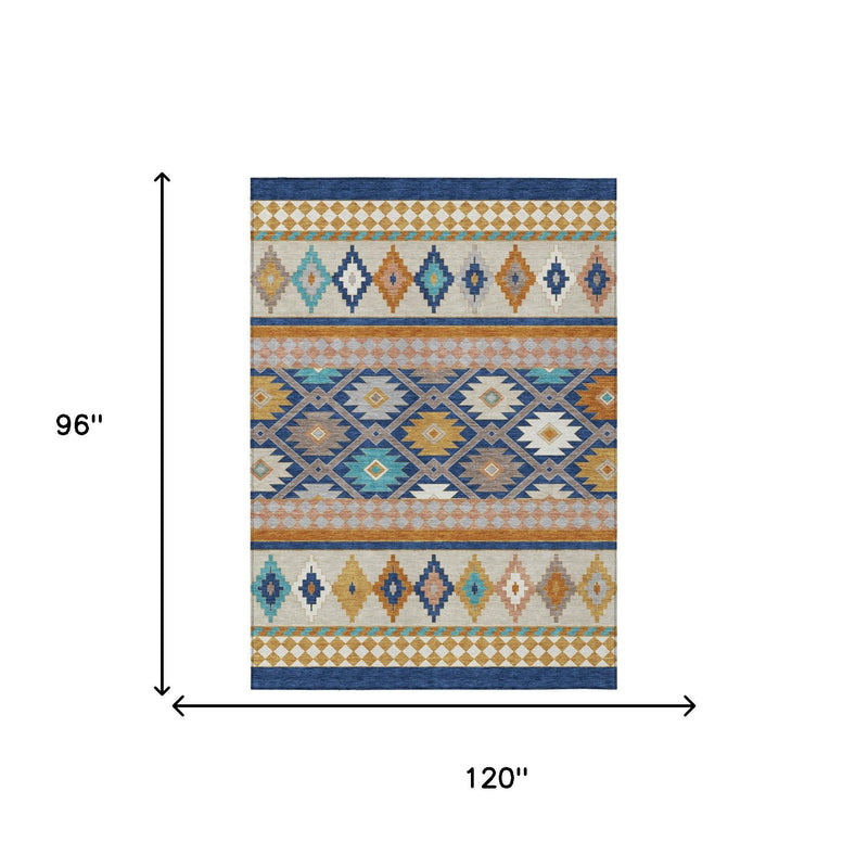 Southwestern area rug with layered stripes, diamonds, and teal, navy, and tan accents.