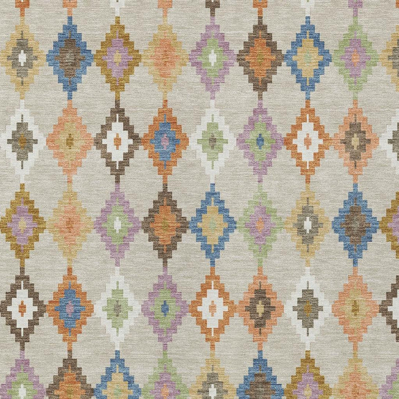 Close-up of cream indoor outdoor area rug with multicolor diamond motifs