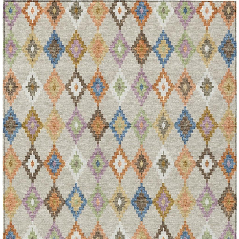 Close-up of ivory indoor outdoor area rug with colorful diamond Aztec pattern
