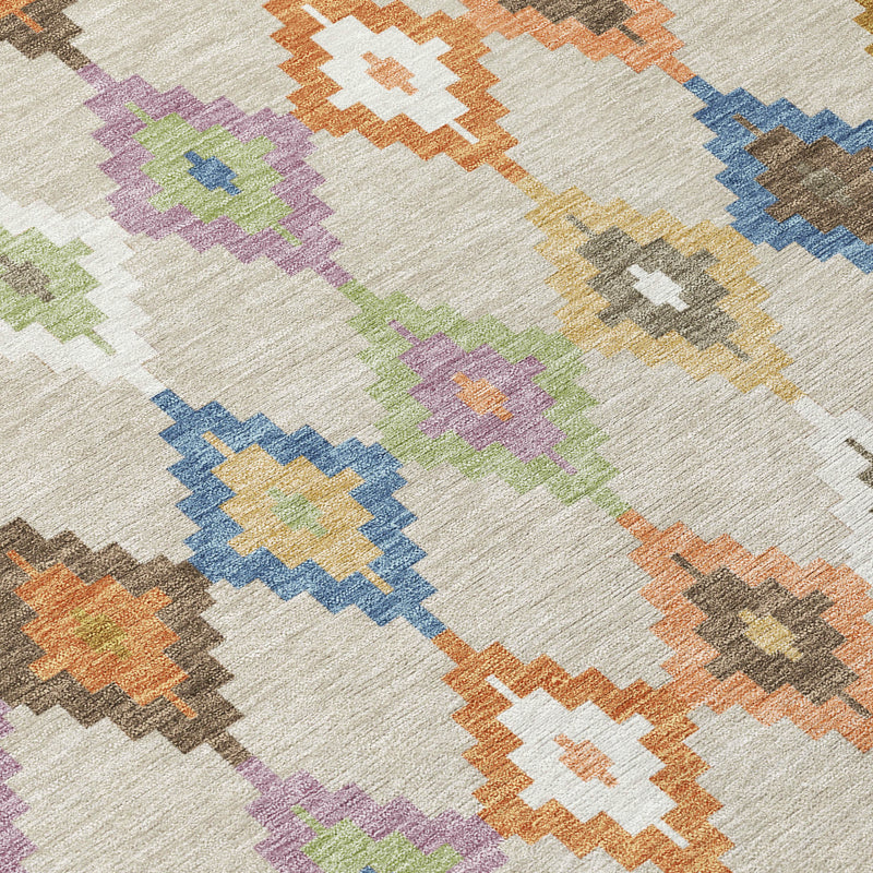 Close-up of indoor outdoor area rug fabric with colorful geometric diamond pattern