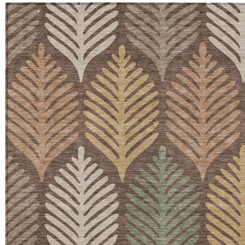Chocolate brown area rug with beige leaf pattern and watercolor-like accents