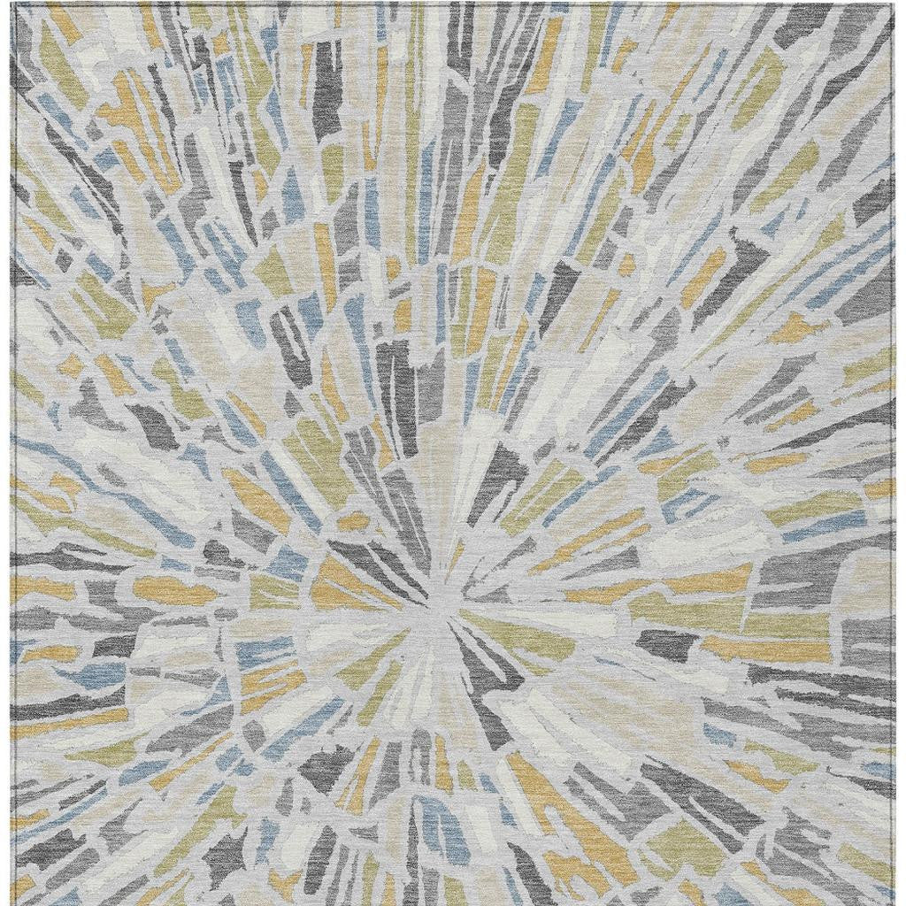 Abstract area rug showing centered silver-gray sunburst with blue and gold accents