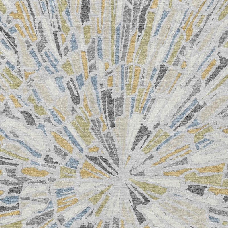 Abstract rug detail with gray, blue, and yellow sunburst rays on light background