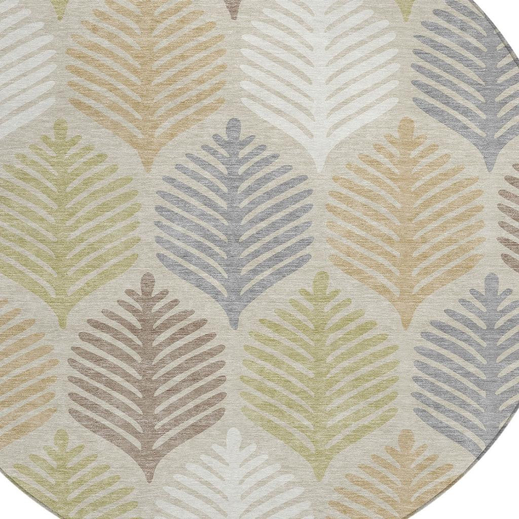 Beige and ivory round indoor/outdoor rug with colorful leaf pattern