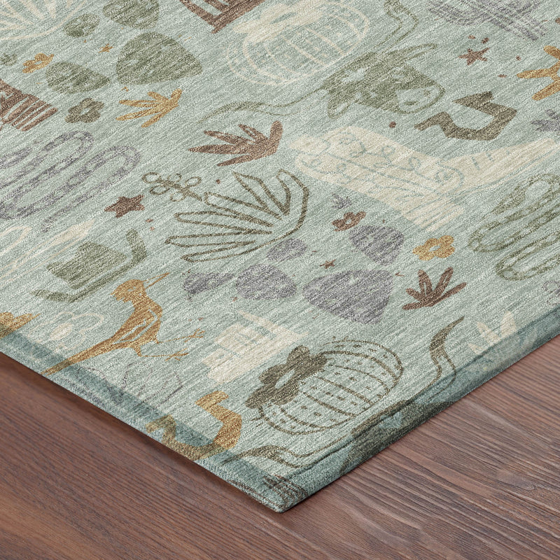Corner of sage green rug with multicolor desert icon pattern and textured flat weave