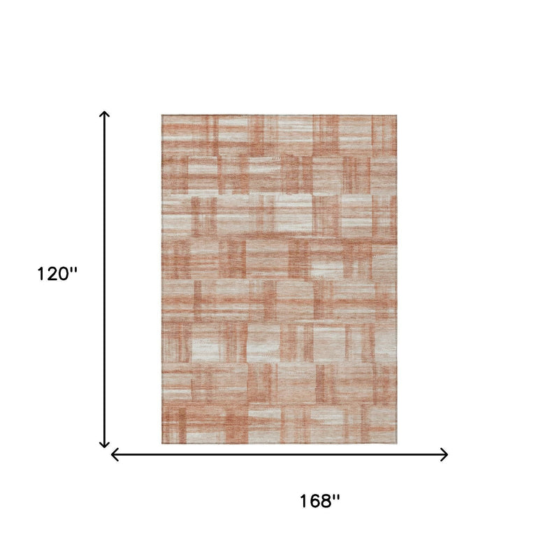 Rust-colored geometric area rug, 10x14 feet, soft woven texture, modern design ideal for living room decor.