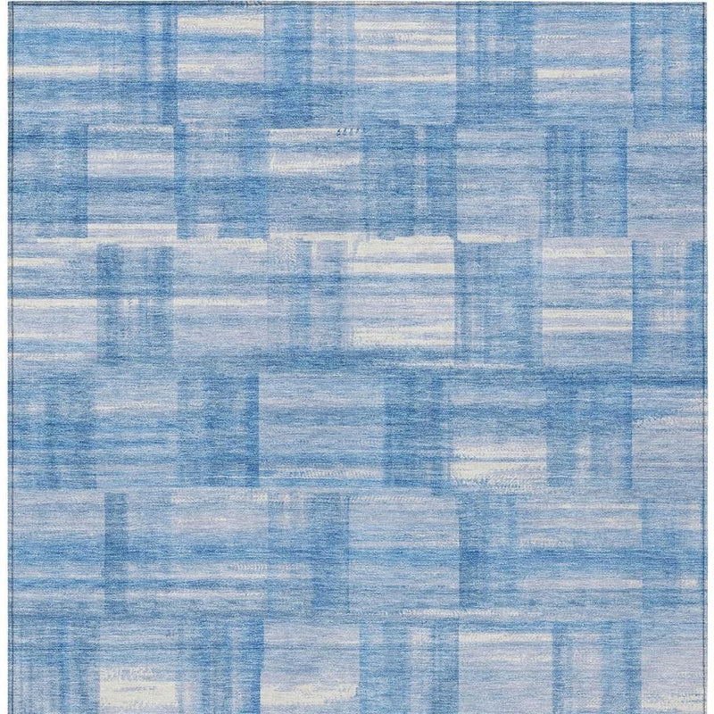 Close-up of blue and ivory patchwork grid area rug texture