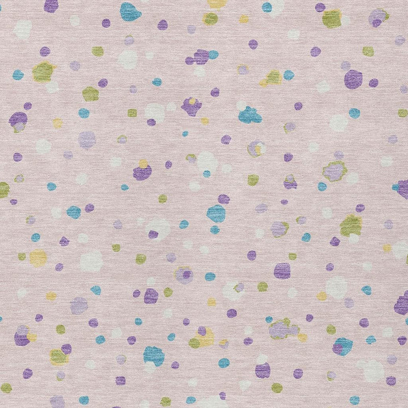 Pink and ivory area rug close-up with multicolor pebble pattern