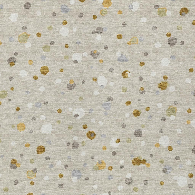 Beige rug surface with gold and multicolor geometric speckles pattern